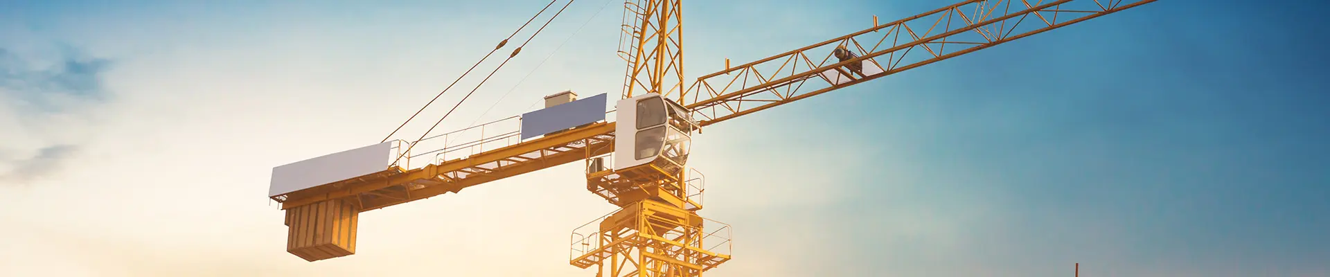 A crane, showcasing its structure against the skyline. A crane, showcasing its structure against the skyline.