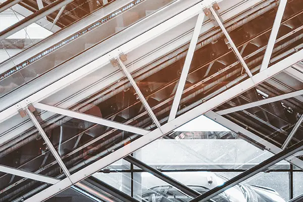 An escalator is prominently displayed within a modern indoor building, showcasing its sleek design and functionality.