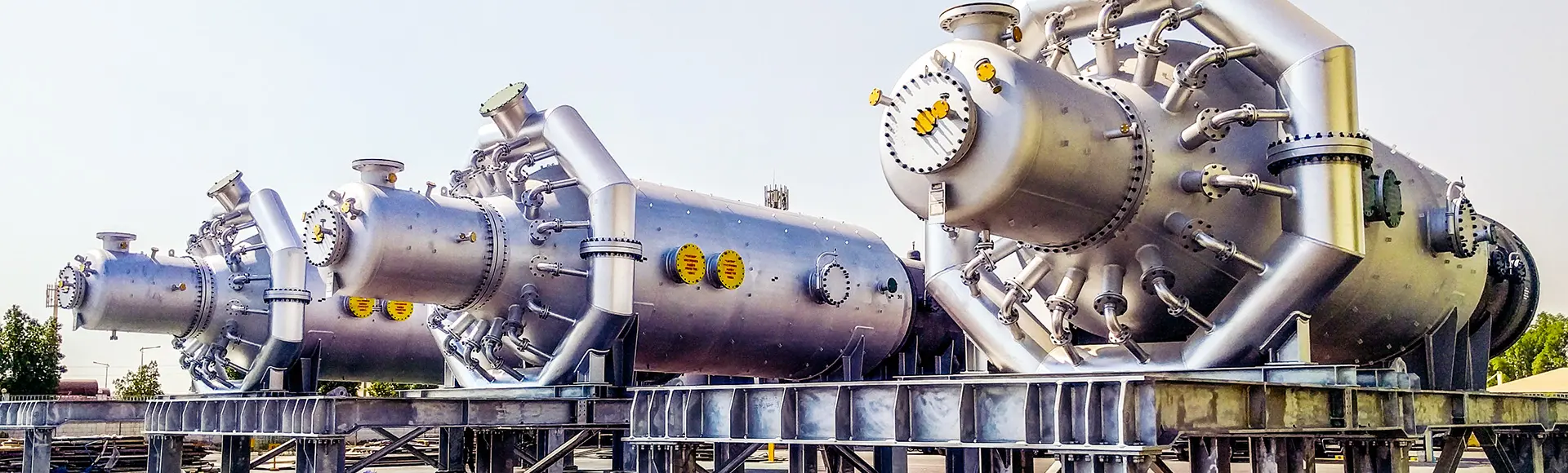 Several large pressure vessels set up outdoors. Several large pressure vessels set up outdoors.