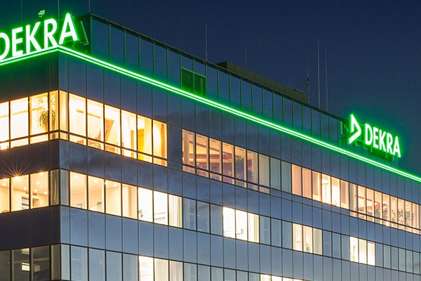 A business property with the words DEKRA on the facade.