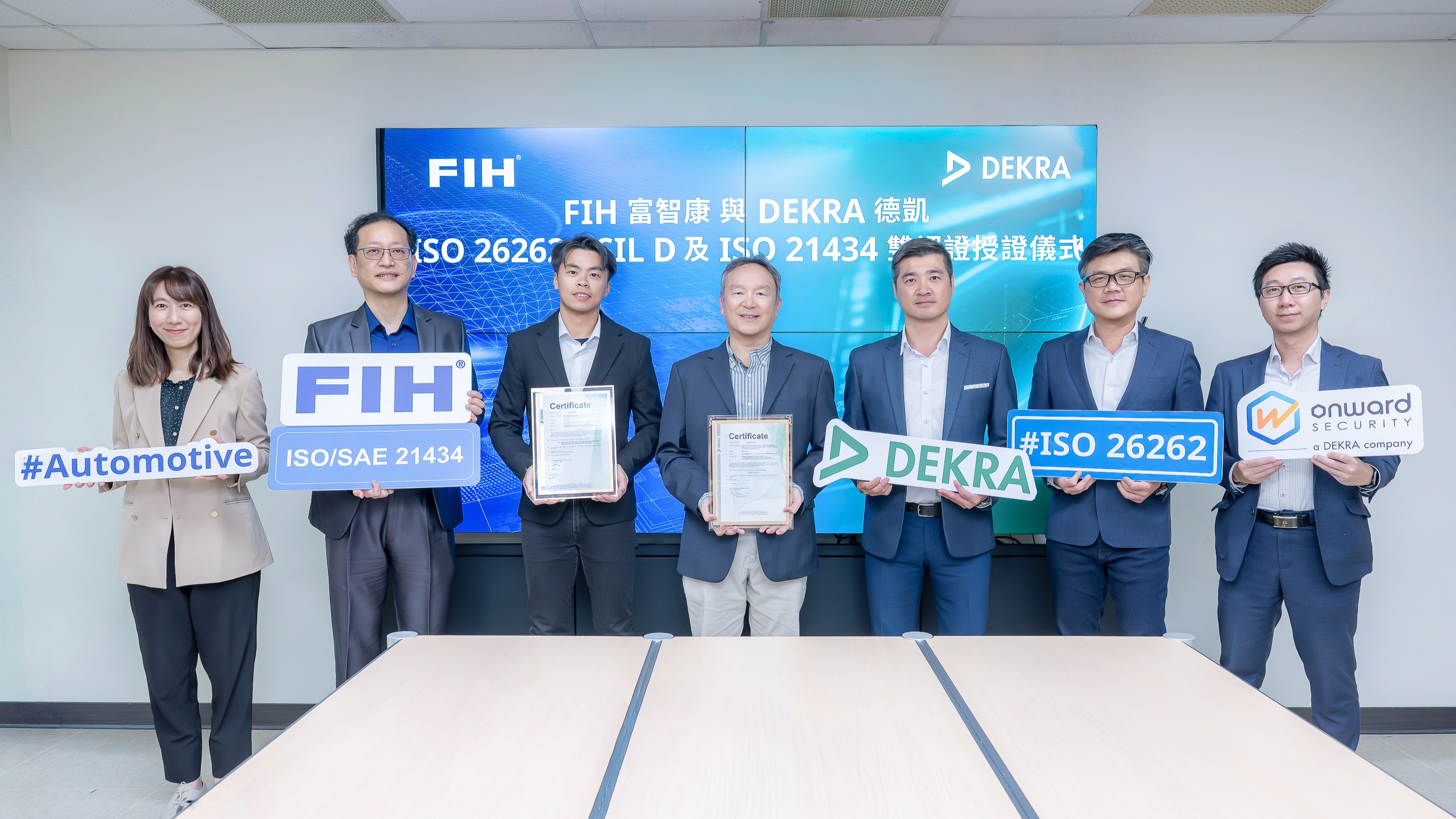 FIH’s Automotive Electronics Team team poses for a group photo with the expert team from DEKRA