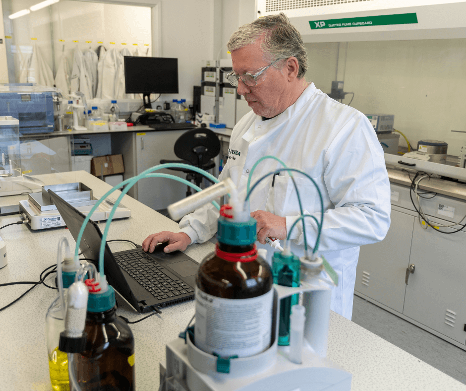 man in a lab carryin gout a test