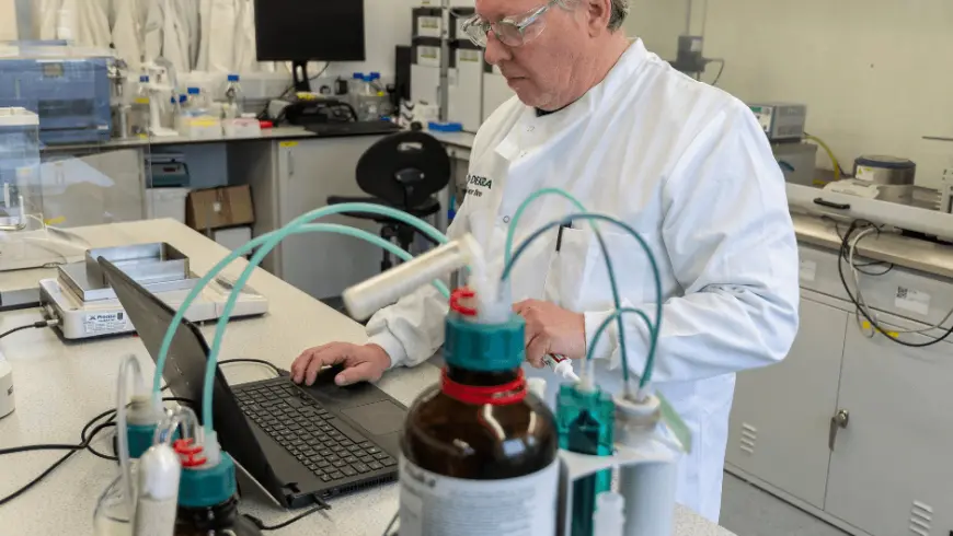 man in a lab carryin gout a test