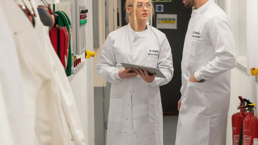 Two lab scientists discussing