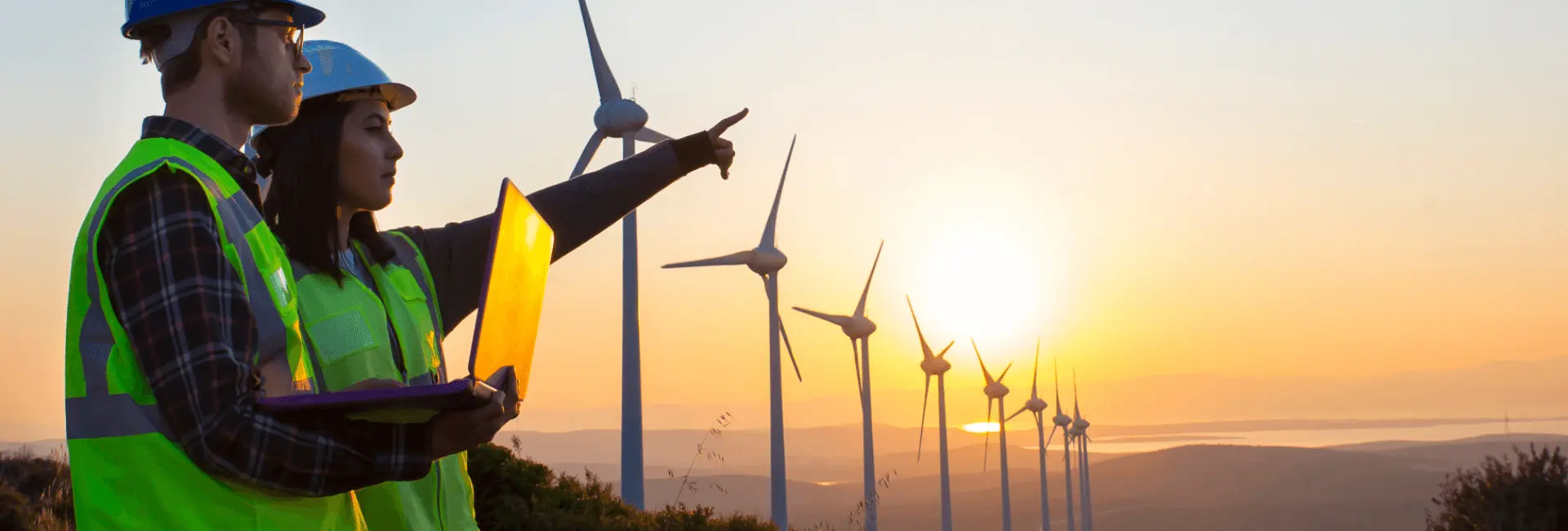 Man and woman assessing a wind farm