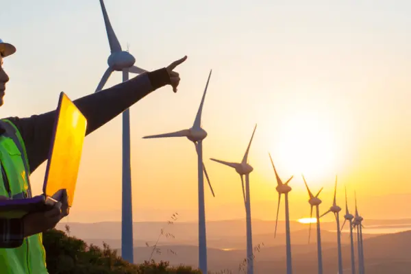 Man and woman assessing a wind farm