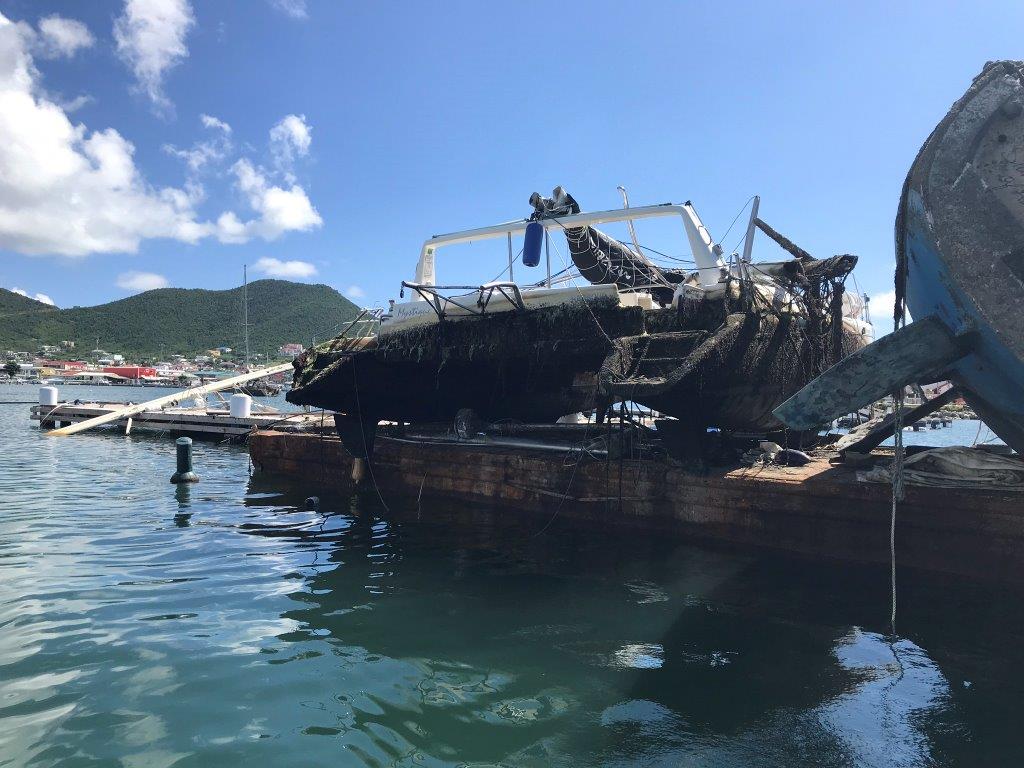 damaged boat on landing stage