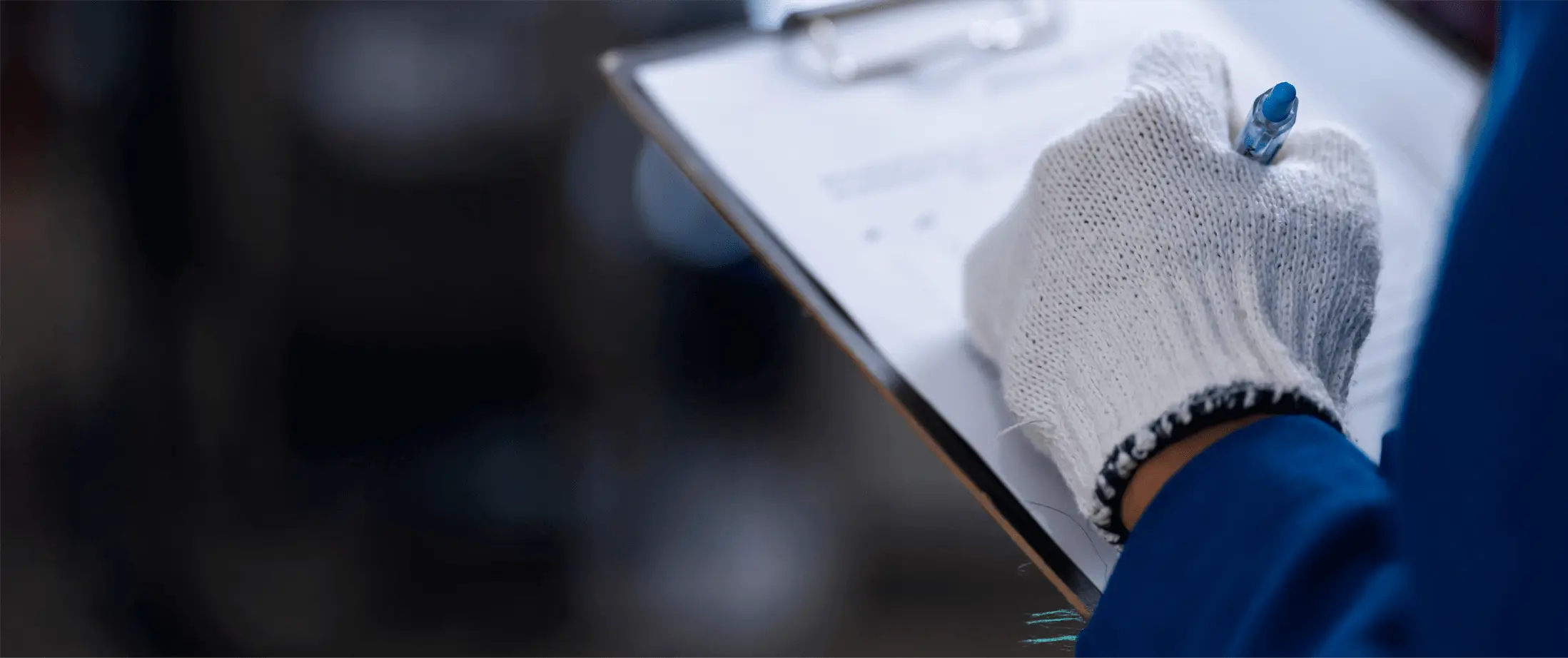 A person writing down on a piece of paper. A person writing down on a piece of paper.